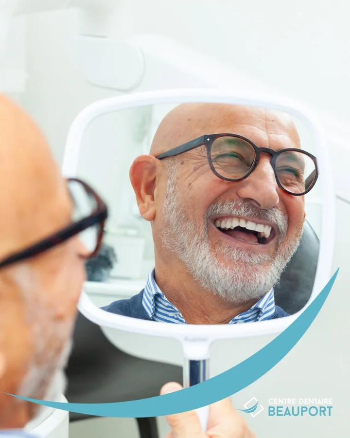 Centre dentaire Beauport ad: a patient smiling in the mirror