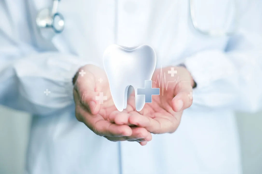Outstretched hands holding a stylized tooth